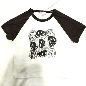 black and white blouse with smiley faces